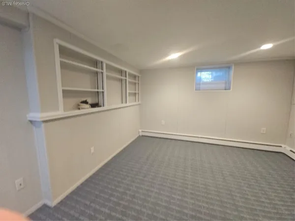 an empty room with a empty space and window