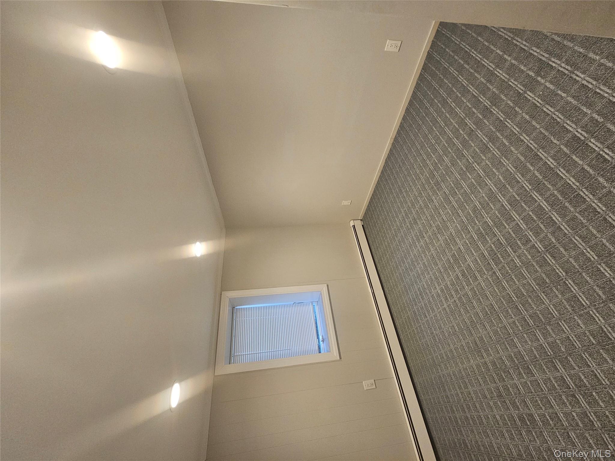 43 Hartman Hill Road Huntington, NY 11743 - Photo 7 of 10 an empty room with a workbench