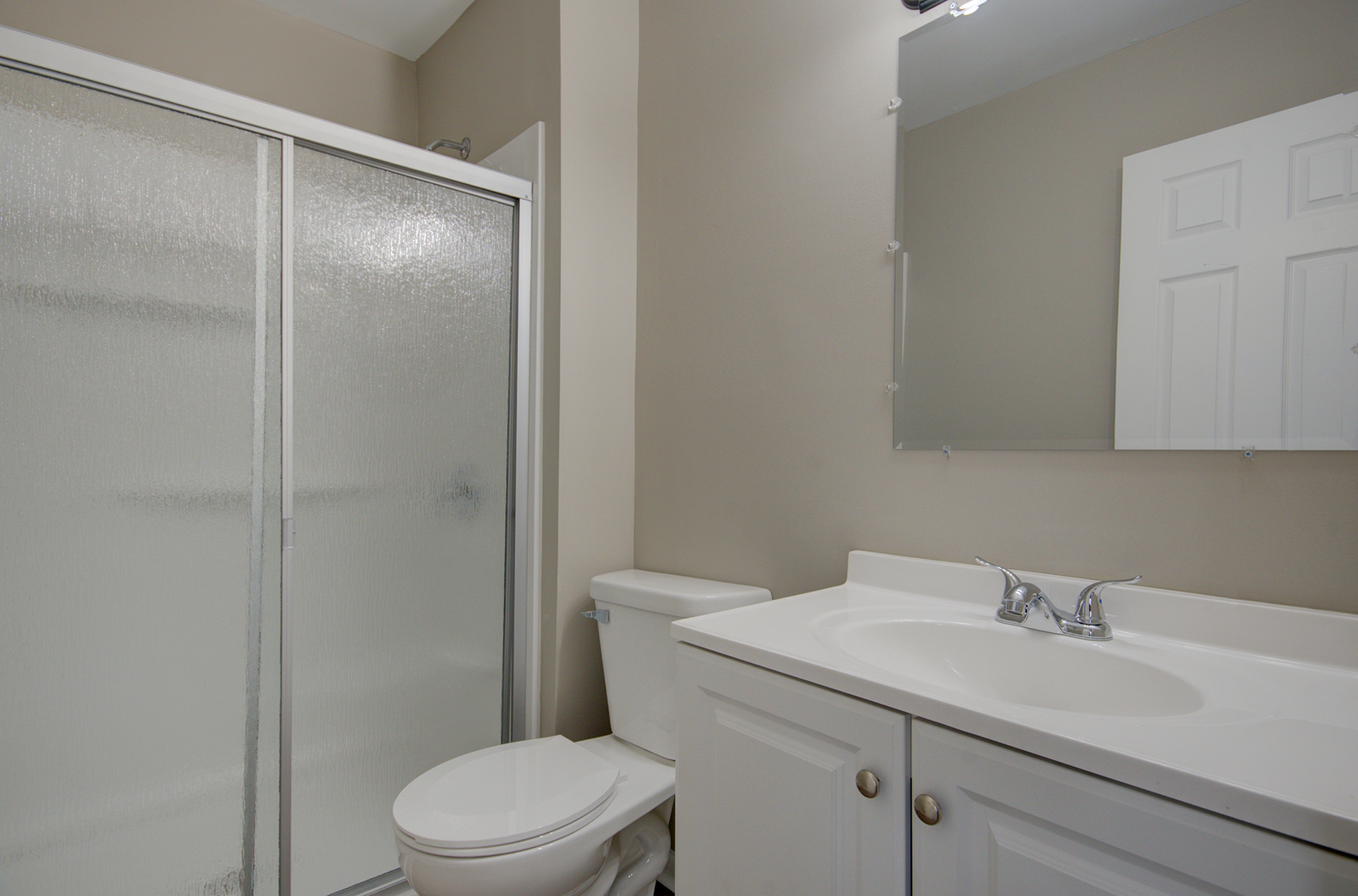 304 Walnut Circle Bolingbrook, IL 60440 - Photo 19 of 23 a bathroom with a sink toilet and vanity