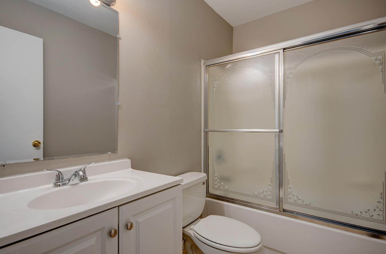 304 Walnut Circle Bolingbrook, IL 60440 - Photo 20 of 23 a bathroom with a granite countertop sink toilet and shower