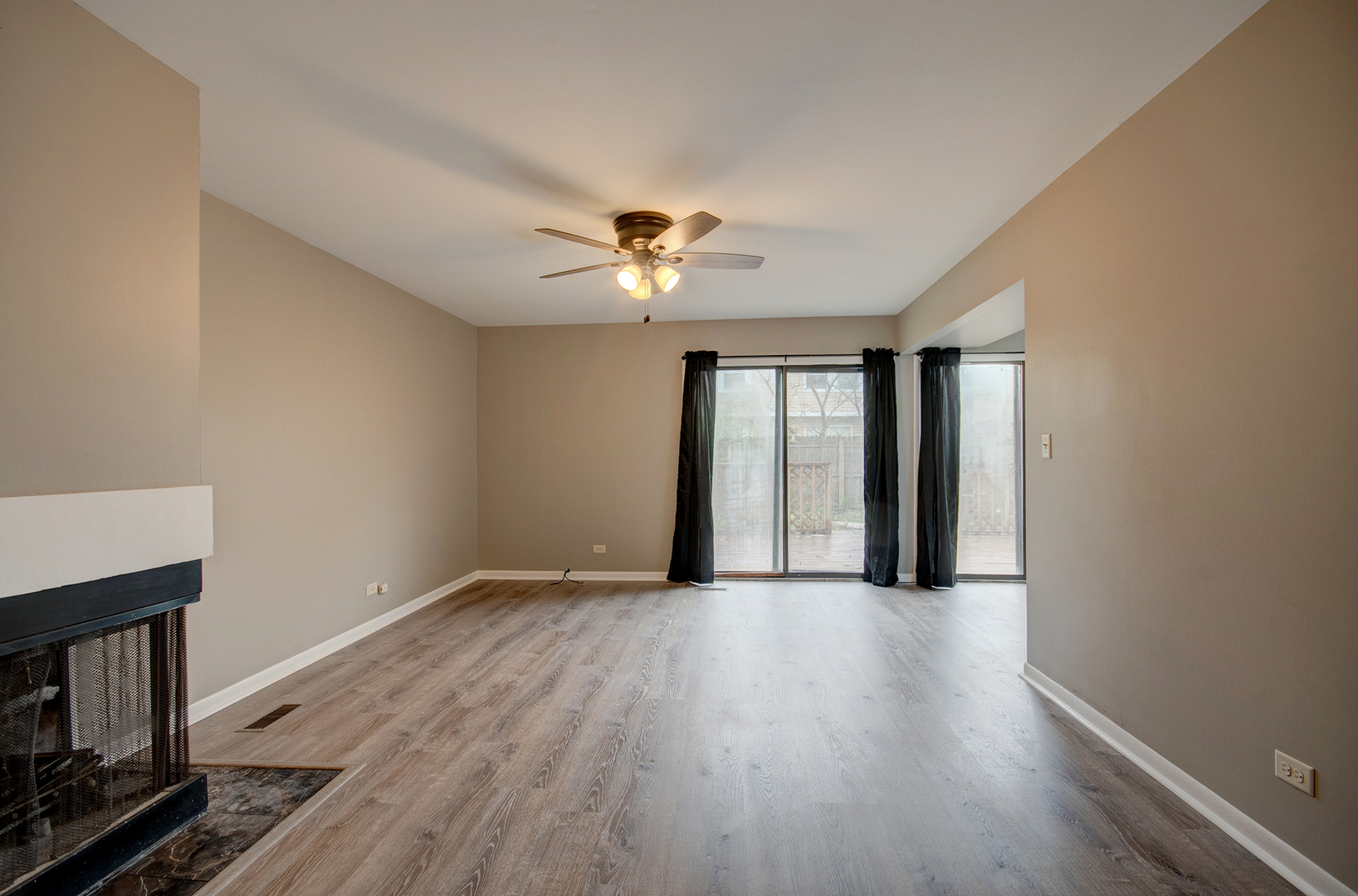 304 Walnut Circle Bolingbrook, IL 60440 - Photo 7 of 23 wooden floor in an empty room with a window