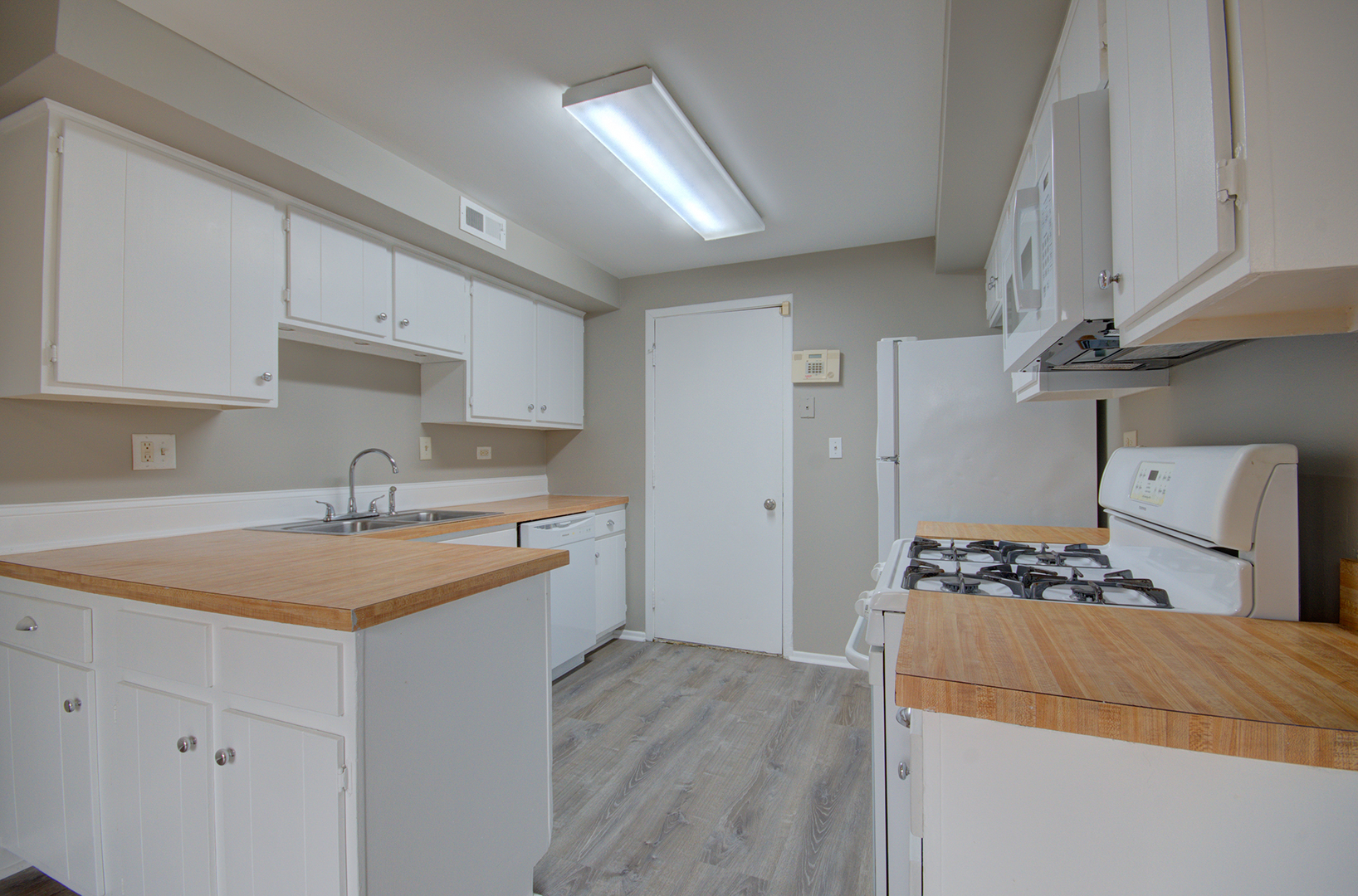 304 Walnut Circle Bolingbrook, IL 60440 - Photo 10 of 23 a kitchen with a sink stove and cabinets