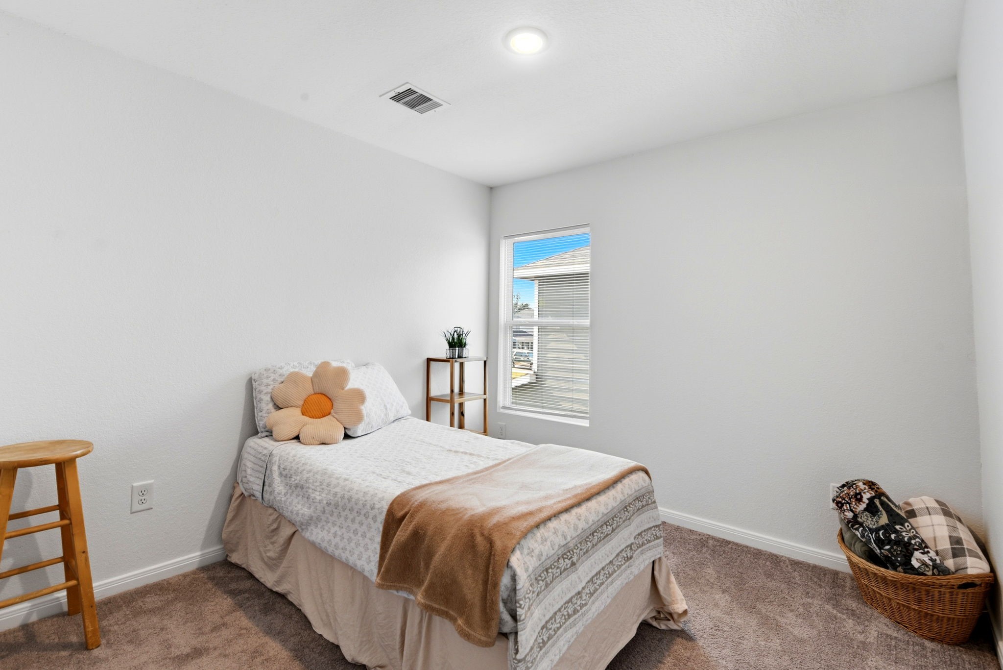9819 Emerald Stone Way Conroe, TX 77306 - Photo 30 of 38 a bedroom with a bed and a window