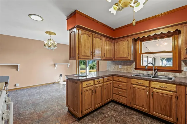 a kitchen that has a sink and cabinets