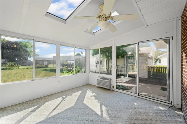 a view of a patio with a table and chairs