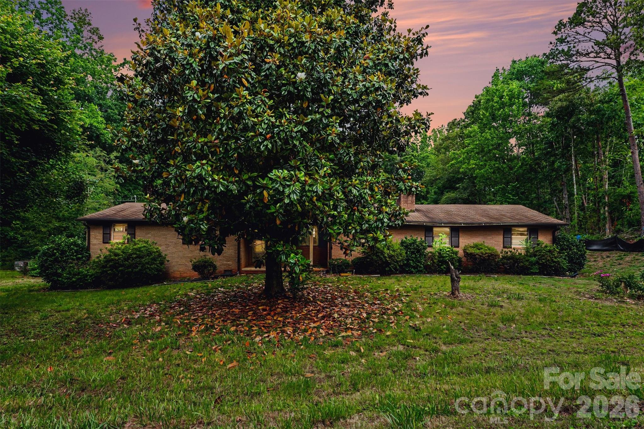 2871 Loviee Road Lincolnton, NC 28092 - Photo 1 of 14 a front view of a house with garden