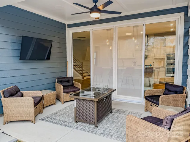 a outdoor living space with patio furniture and a fireplace