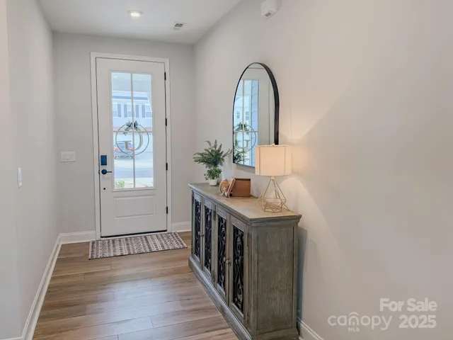 a view of entryway with wooden floor