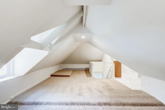 a view of a hallway with stairs