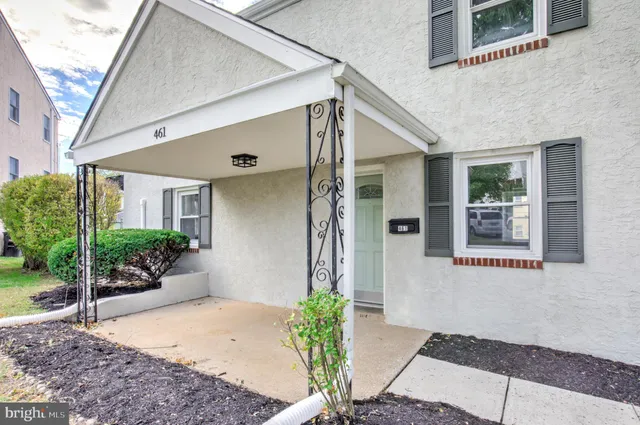 a front view of a house with a glass door