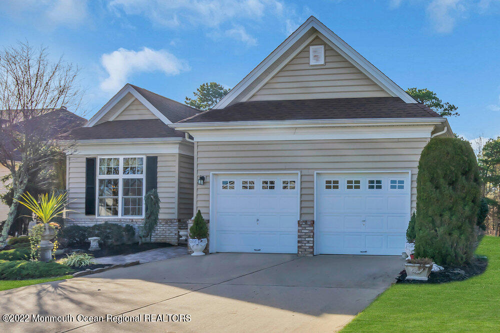 41 Muirfield Road Jackson, NJ 08527 - Photo 3 of 69 a front view of a house with a yard and garage