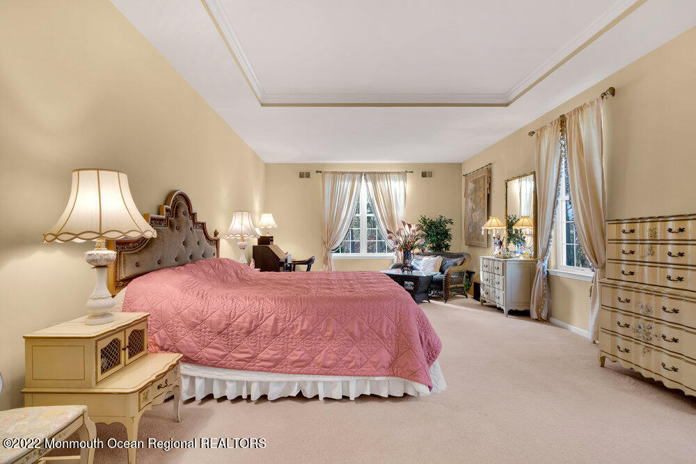 41 Muirfield Road Jackson, NJ 08527 - Photo 36 of 69 a bed room with a bed and a chair