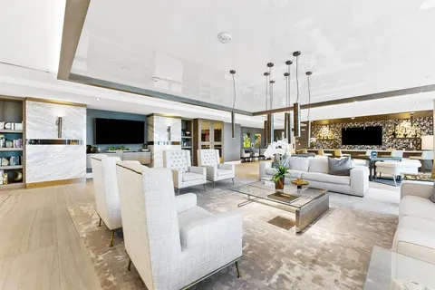 a living room with fireplace furniture and a flat screen tv