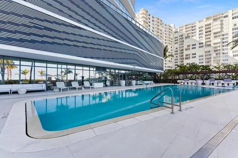 a view of swimming pool having outdoor seating