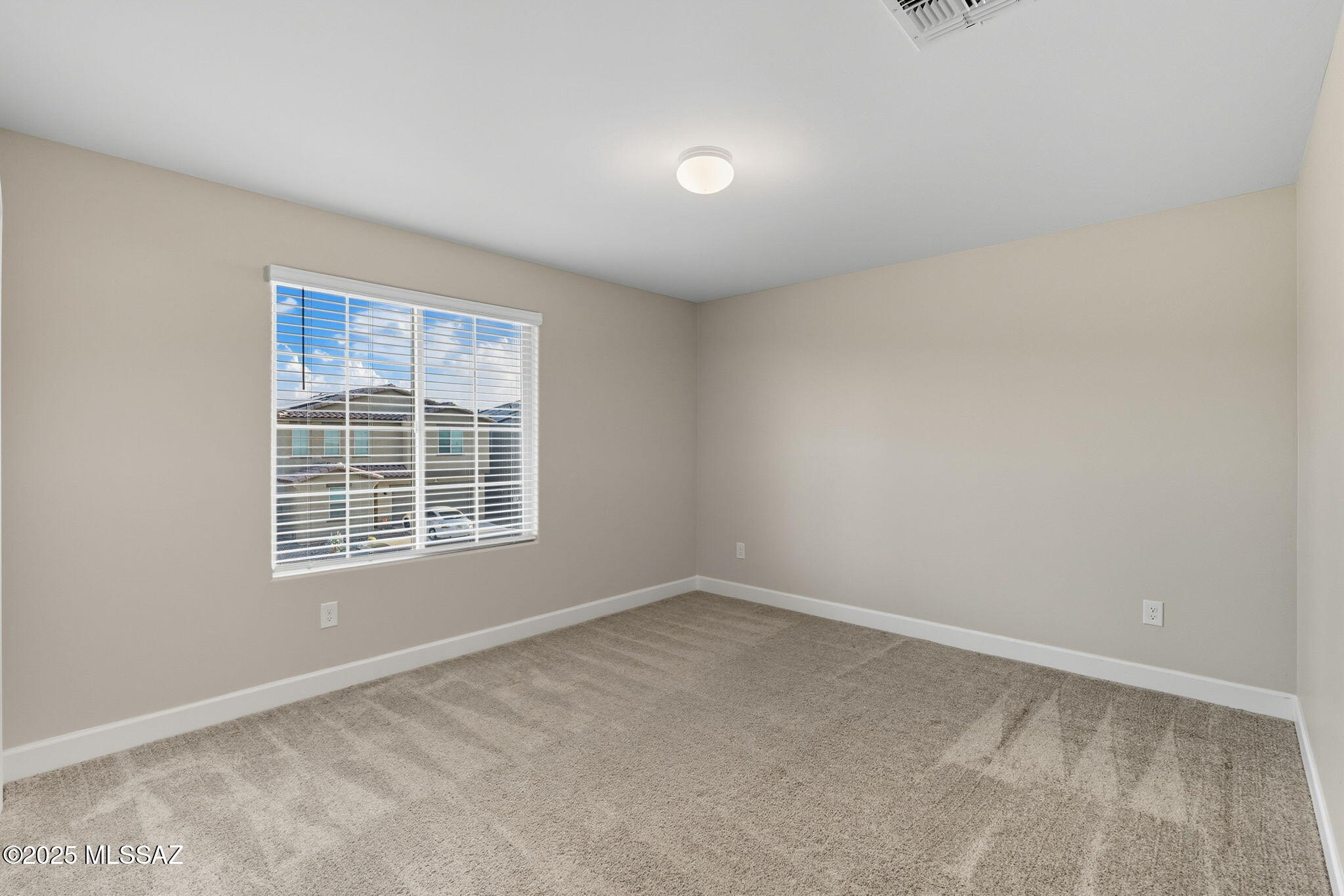 12100 East Ryscott Circle Vail, AZ 85641 - Photo 32 of 53 an empty room with a window
