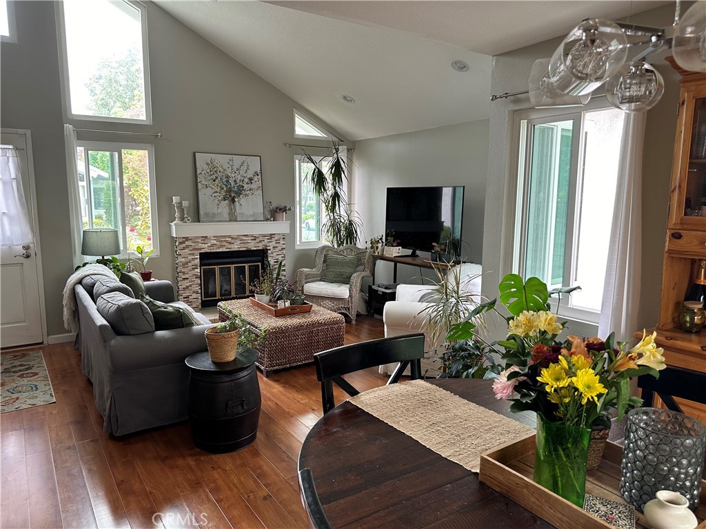 39 Wintermist Irvine, CA 92614 - Photo 6 of 14 a living room with furniture flat screen tv and a fireplace