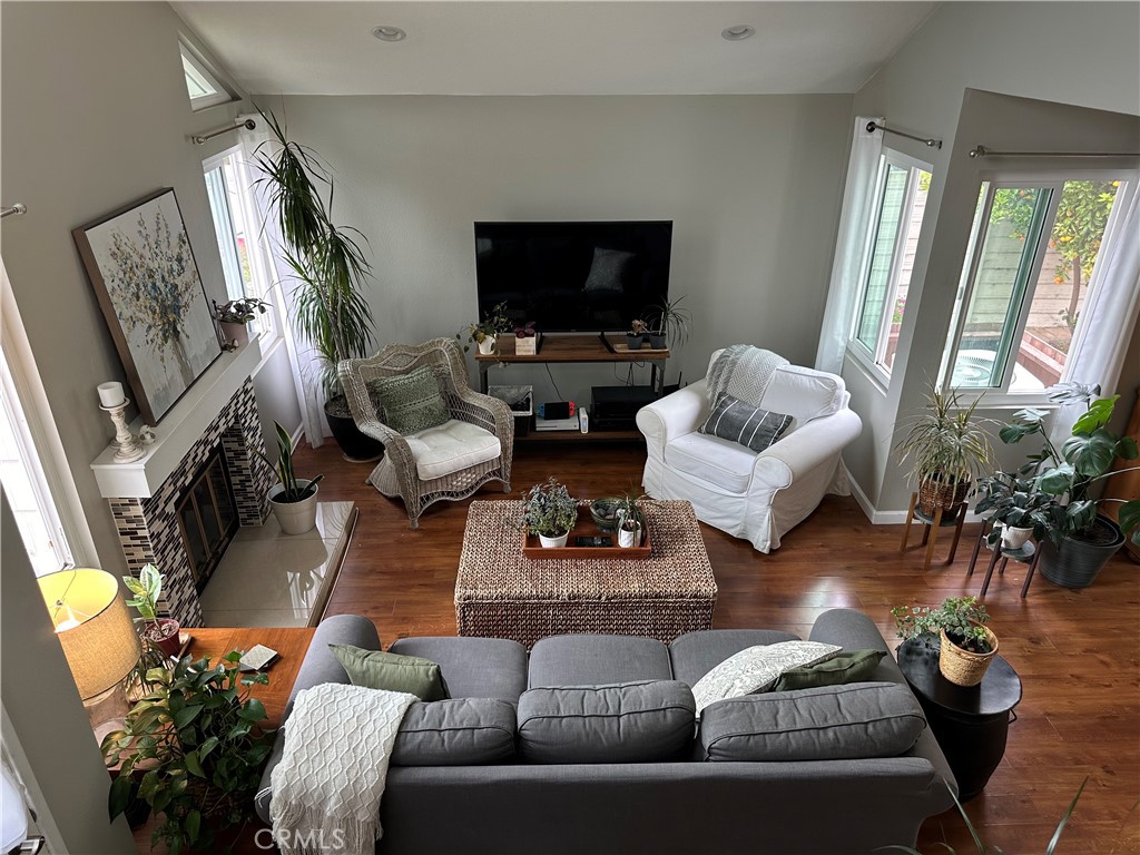 39 Wintermist Irvine, CA 92614 - Photo 7 of 14 a living room with furniture fireplace and flat screen tv