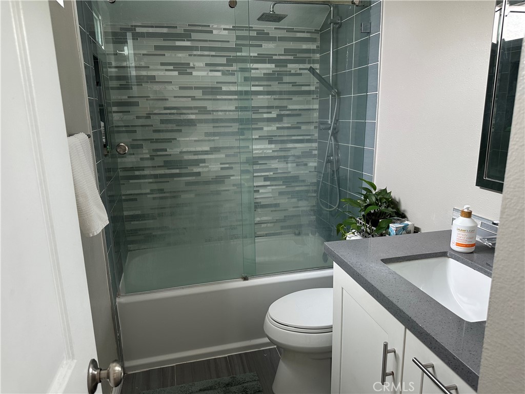 39 Wintermist Irvine, CA 92614 - Photo 10 of 14 a bathroom with a sink a toilet and shower