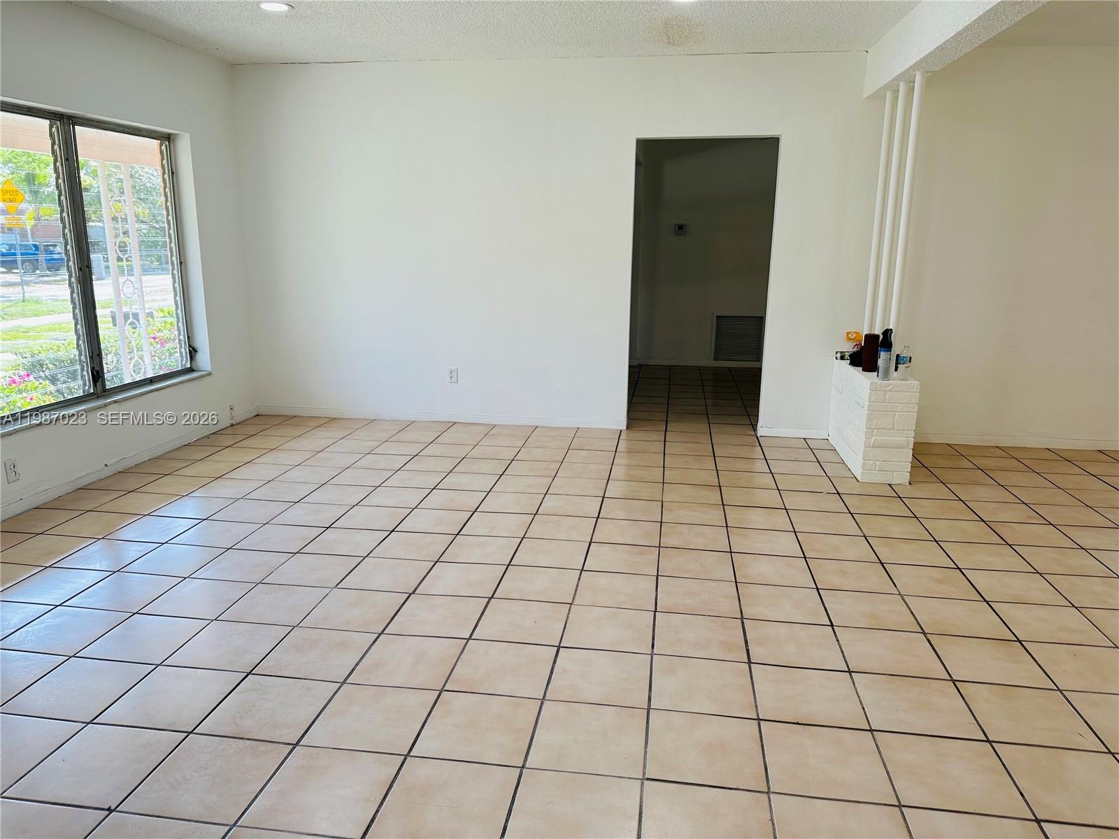 5705 Southwest 39th Street Miami, FL 33155 - Photo 11 of 26 a view of an empty room and window