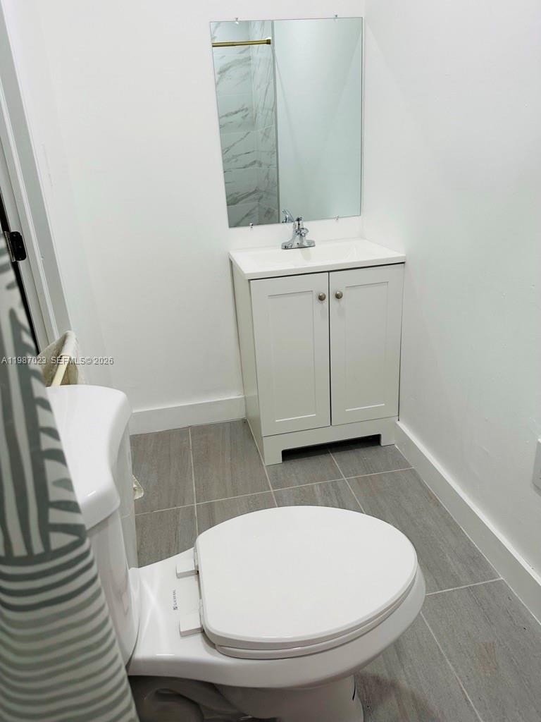 5705 Southwest 39th Street Miami, FL 33155 - Photo 13 of 26 a bathroom with a sink and a mirror