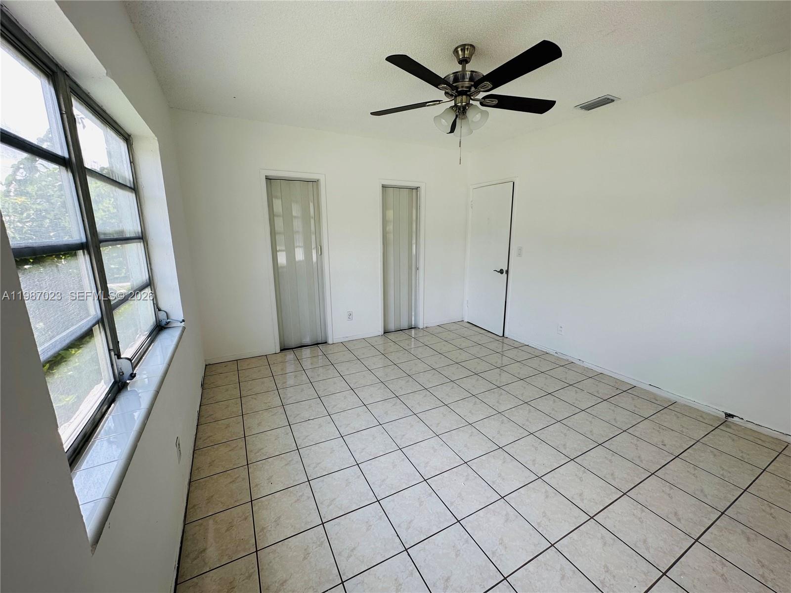 5705 Southwest 39th Street Miami, FL 33155 - Photo 18 of 26 a view of a livingroom with a ceiling fan