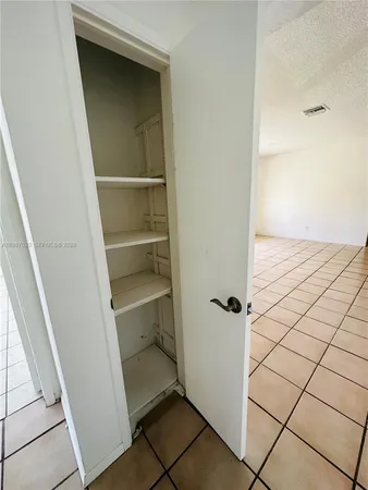a view of an empty walk in closet