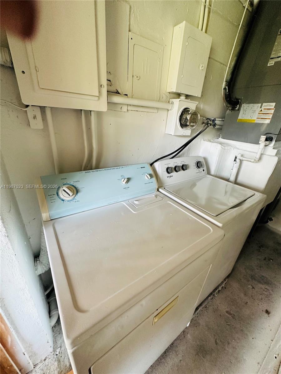 5705 Southwest 39th Street Miami, FL 33155 - Photo 23 of 26 a utility room with dryer and washer