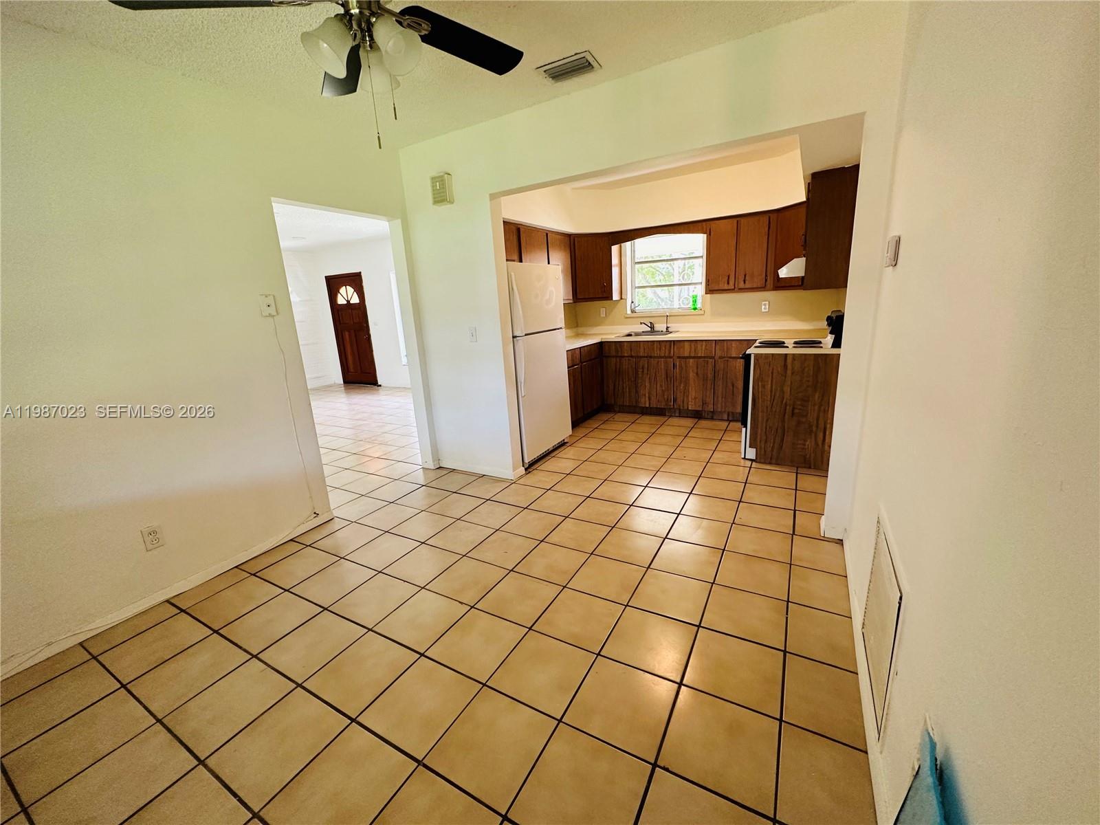 5705 Southwest 39th Street Miami, FL 33155 - Photo 4 of 26 a view of a kitchen with a sink