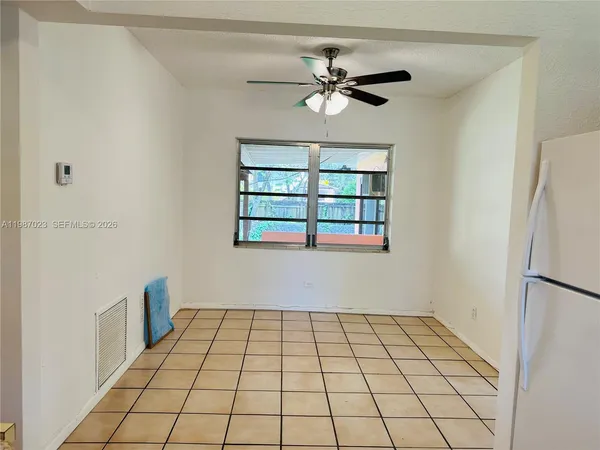 a view of an empty room with a window