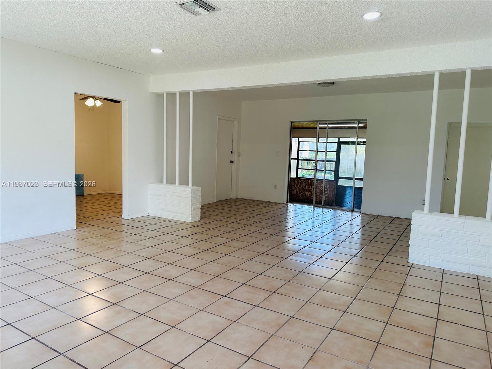 5705 Southwest 39th Street Miami, FL 33155 - Photo 9 of 26 a view of a room & window in a room