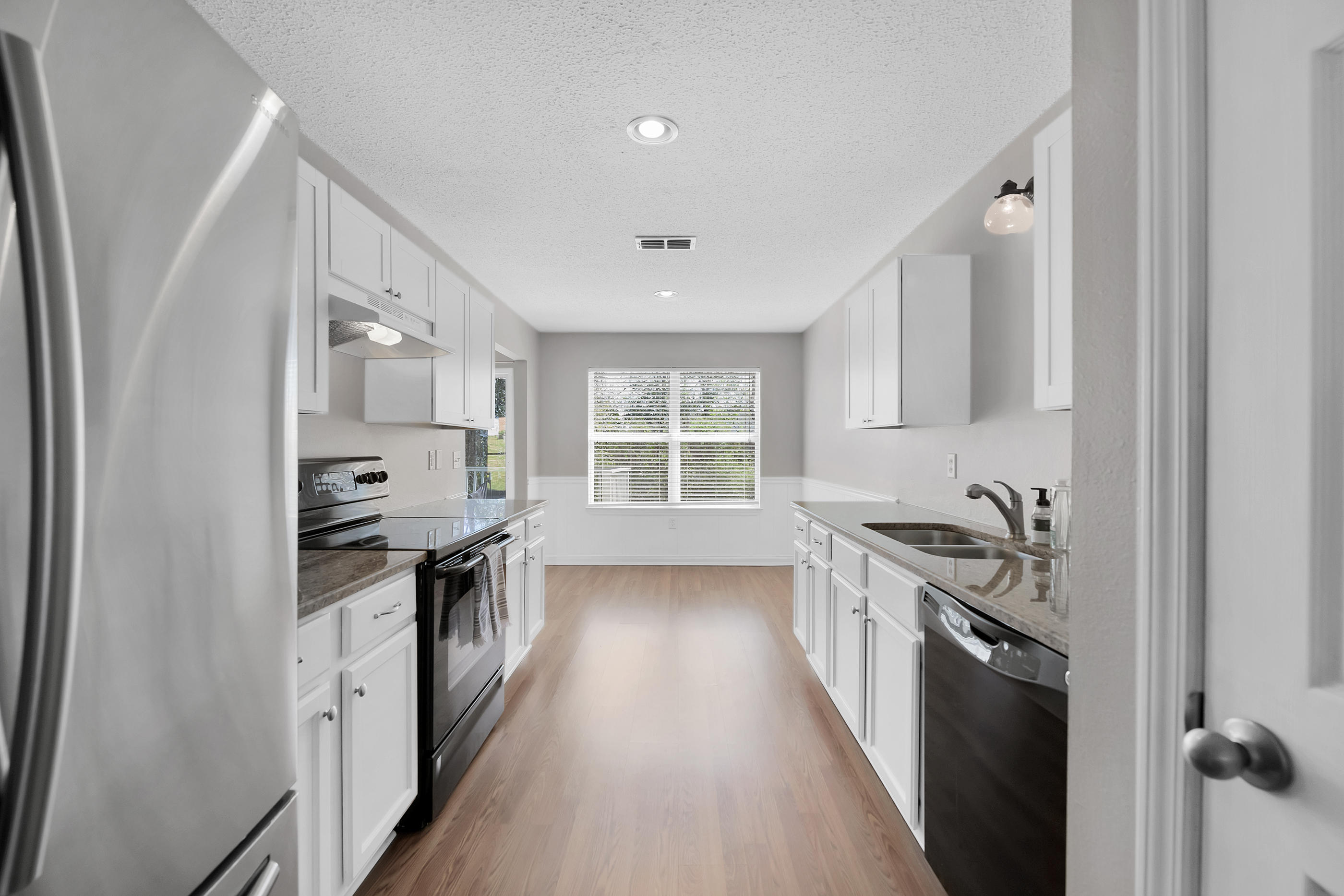 139 Sandstone Trail Crestview, FL 32539 - Photo 12 of 36 a kitchen with stainless steel appliances granite countertop a stove and a sink
