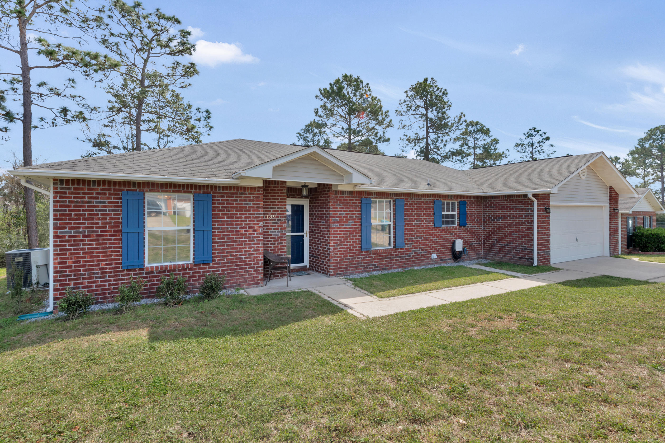 139 Sandstone Trail Crestview, FL 32539 - Photo 2 of 36 a front view of a house with a yard