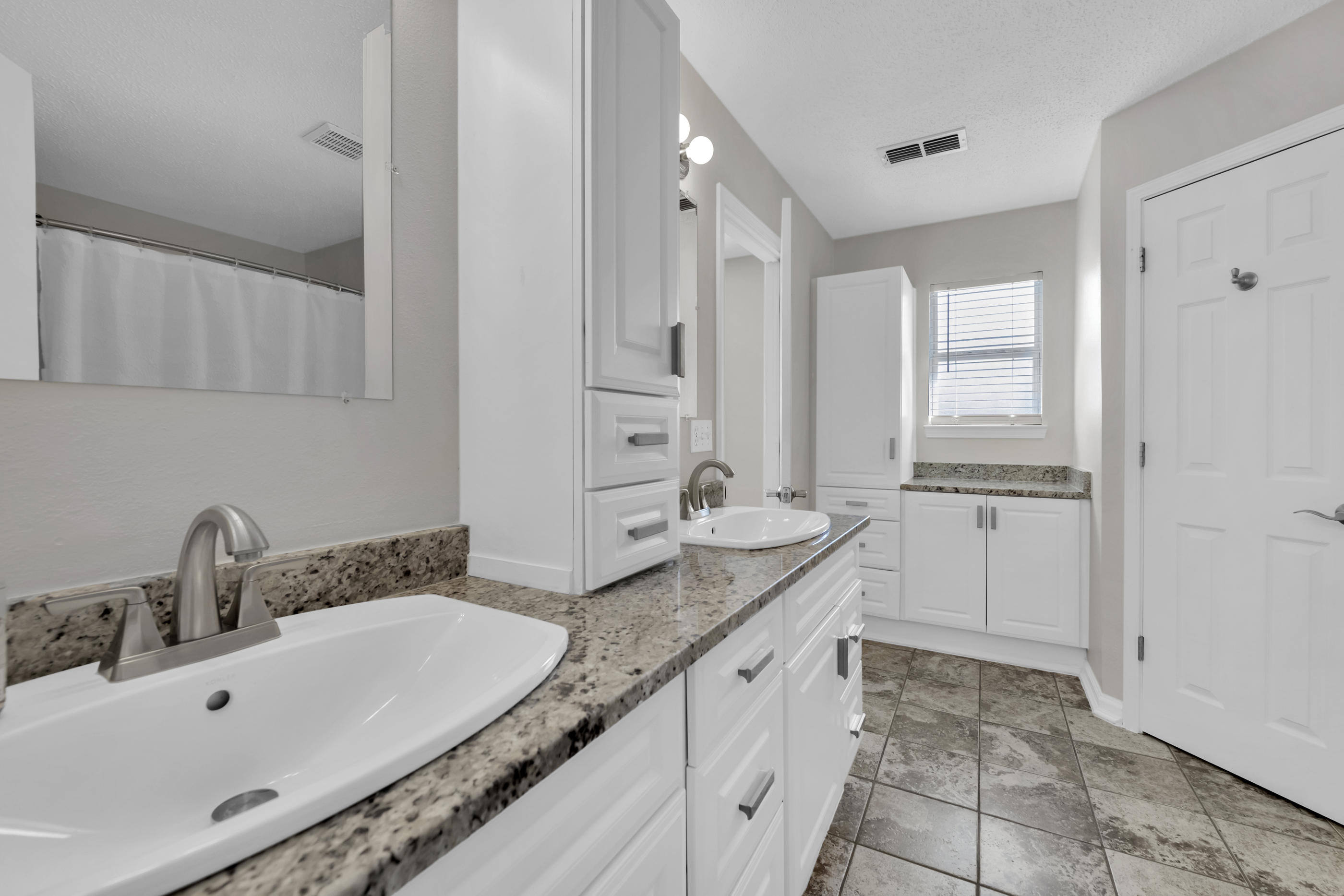 139 Sandstone Trail Crestview, FL 32539 - Photo 22 of 36 a bathroom with a granite countertop sink and a mirror