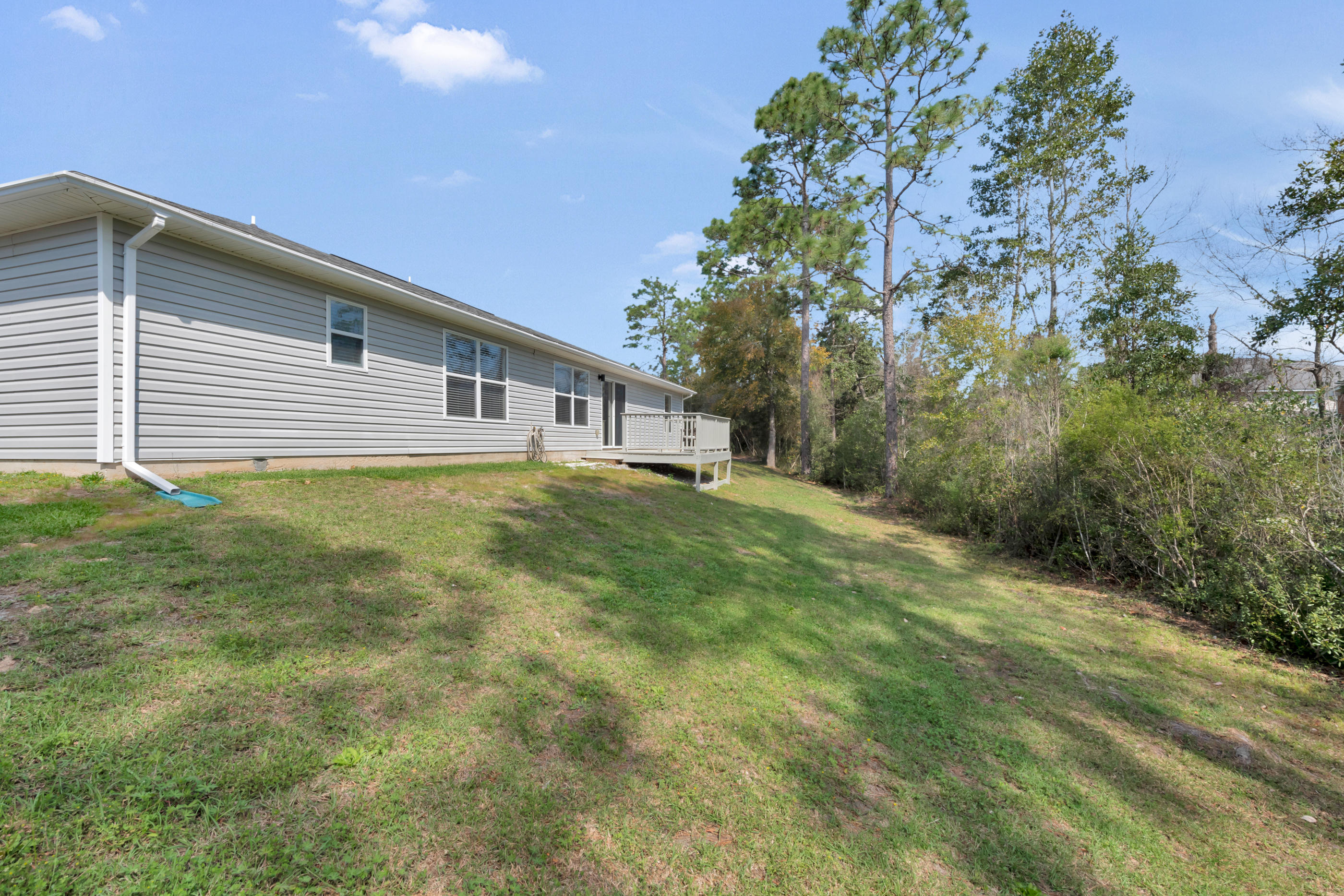 139 Sandstone Trail Crestview, FL 32539 - Photo 30 of 36 a view of a house with a yard