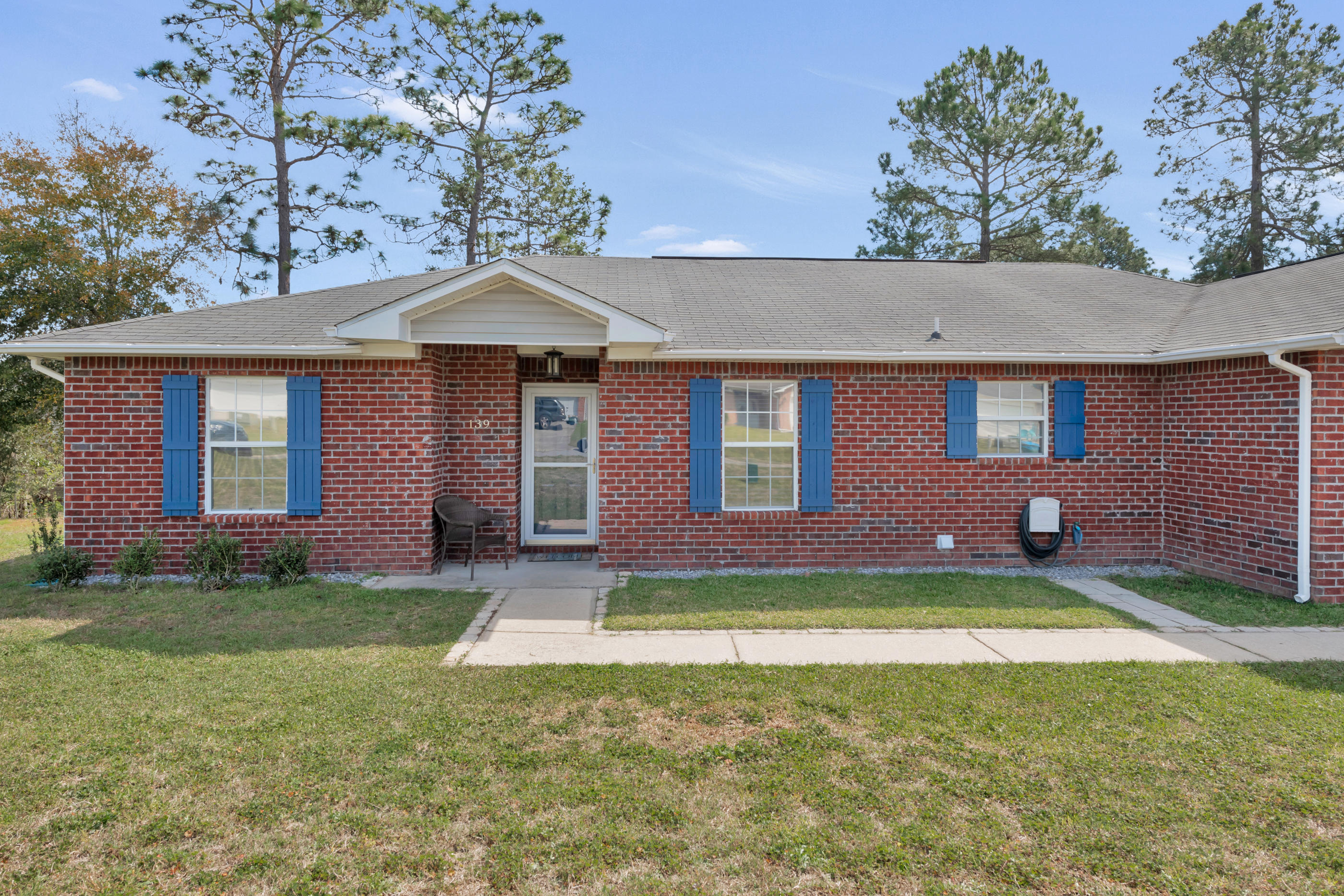 139 Sandstone Trail Crestview, FL 32539 - Photo 3 of 36 a front view of a house with a yard