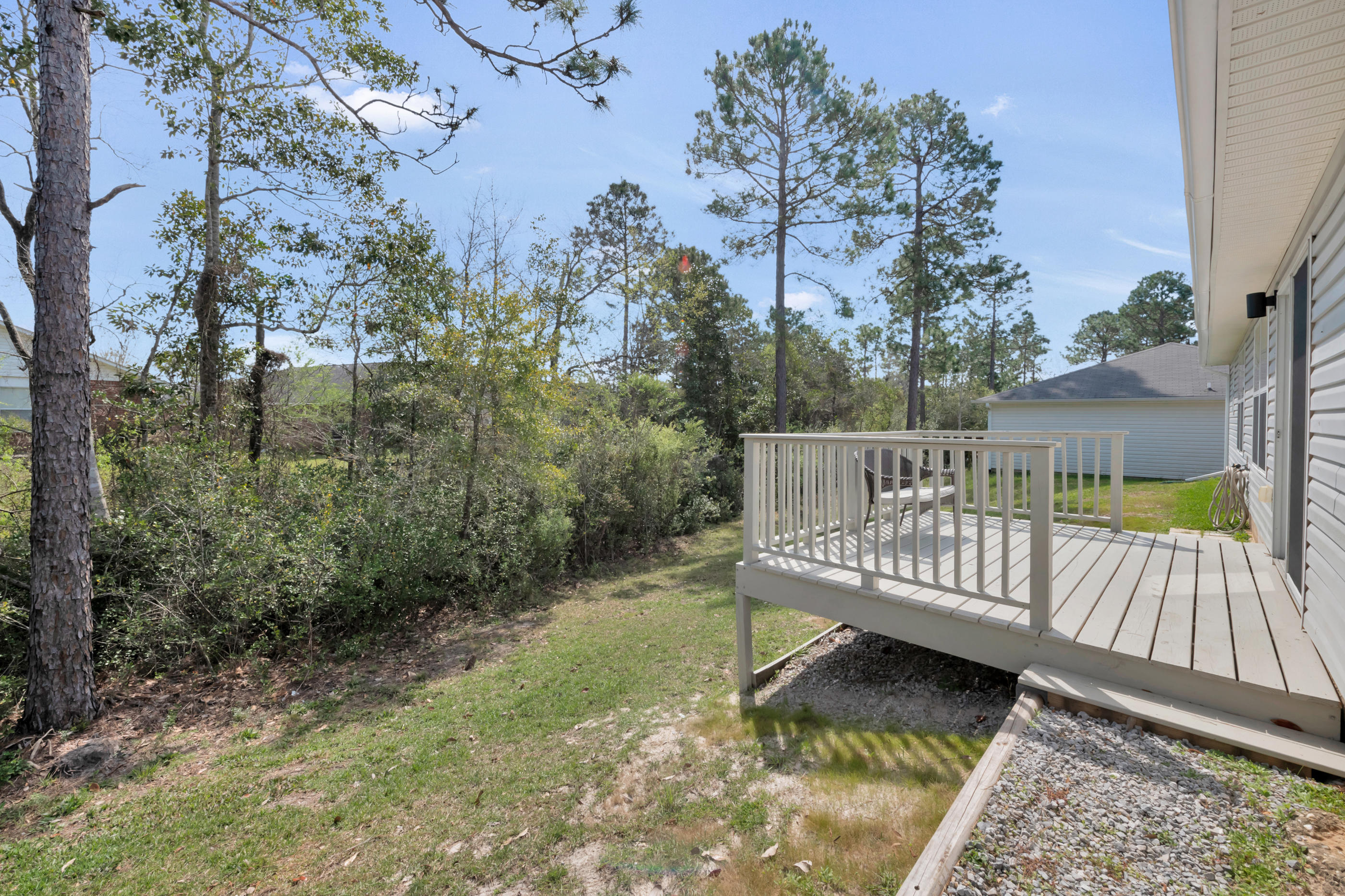 139 Sandstone Trail Crestview, FL 32539 - Photo 31 of 36 a view of a roof deck with wooden floor and fence