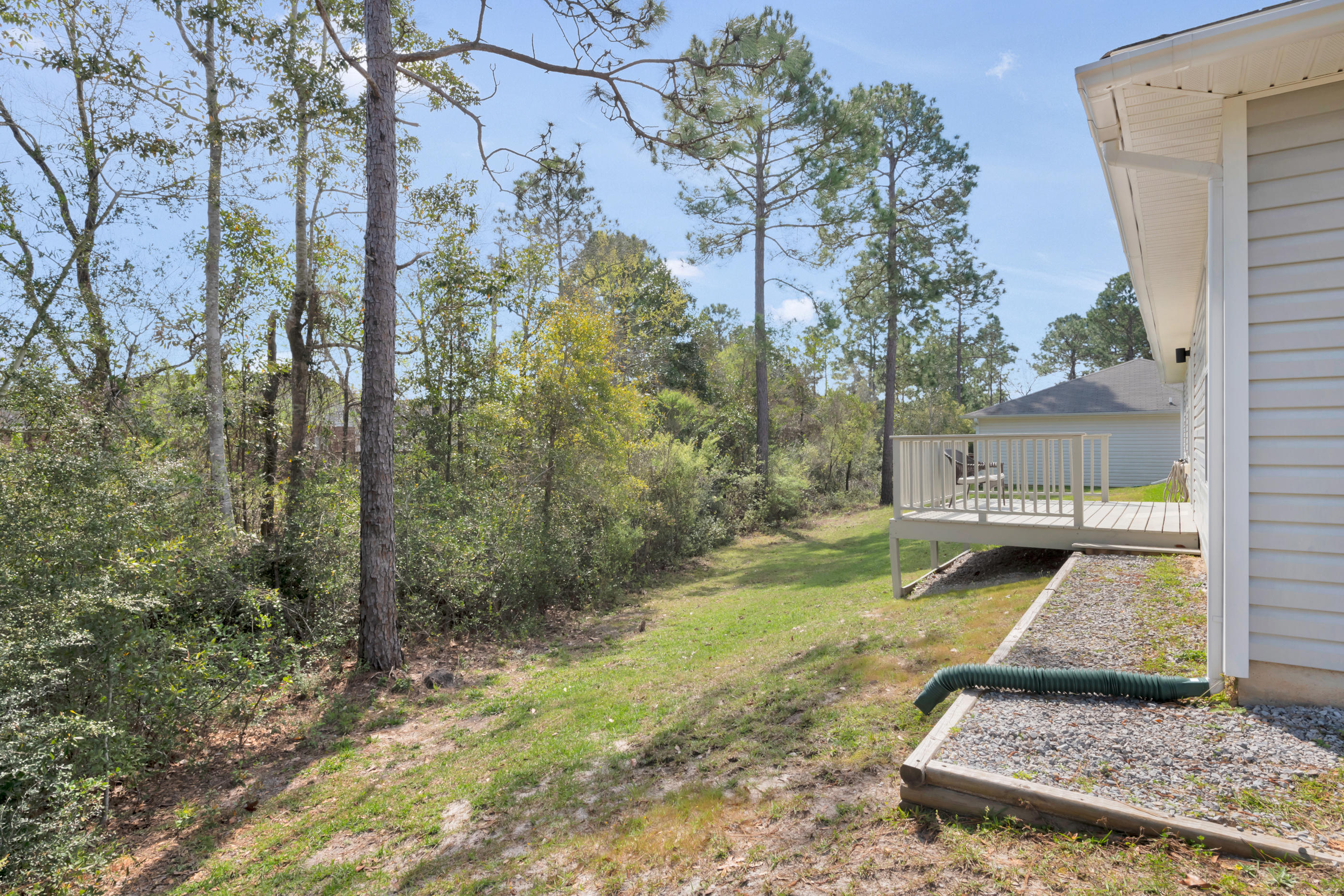 139 Sandstone Trail Crestview, FL 32539 - Photo 32 of 36 a view of a yard with plants and trees