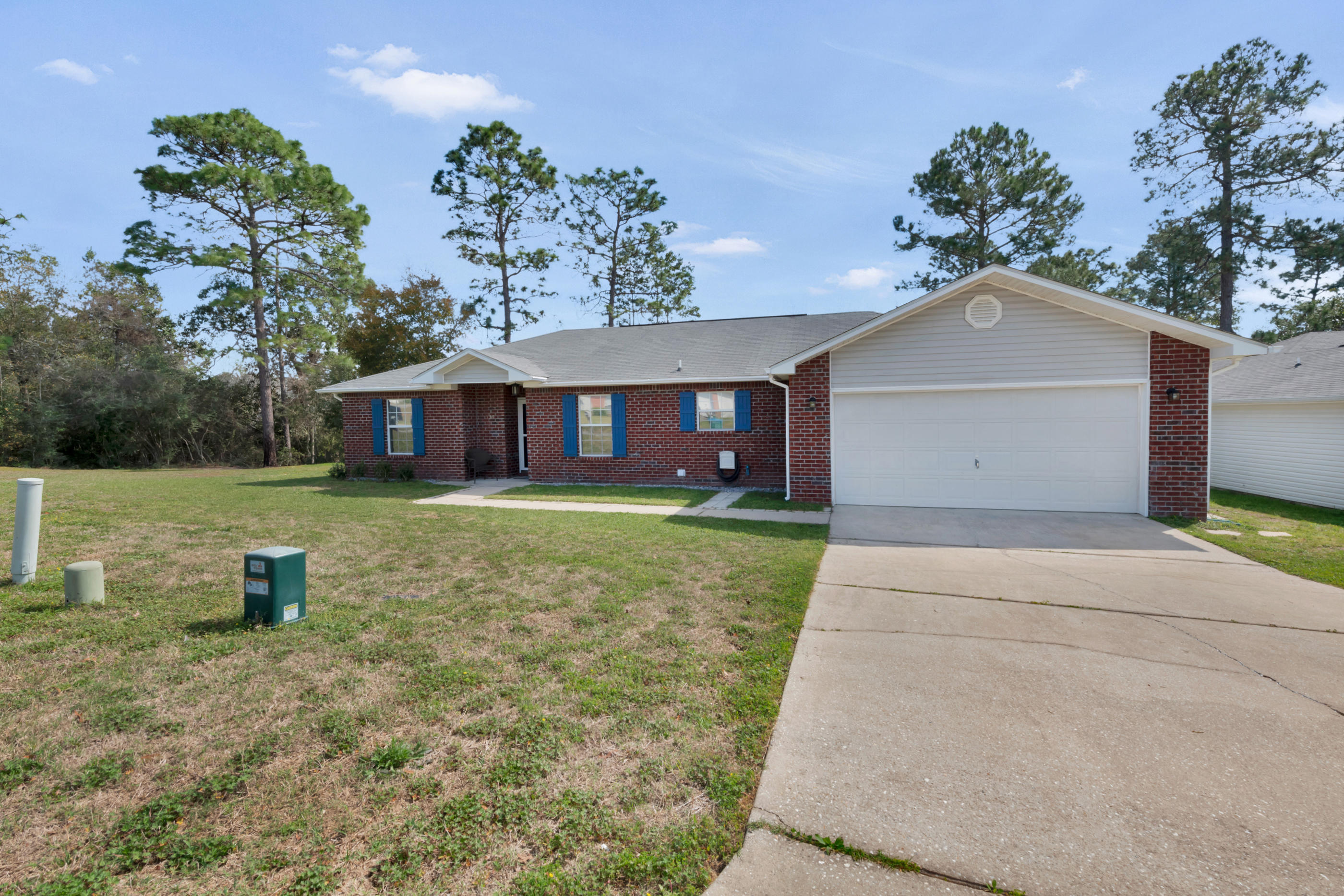 139 Sandstone Trail Crestview, FL 32539 - Photo 33 of 36 a front view of a house with garden