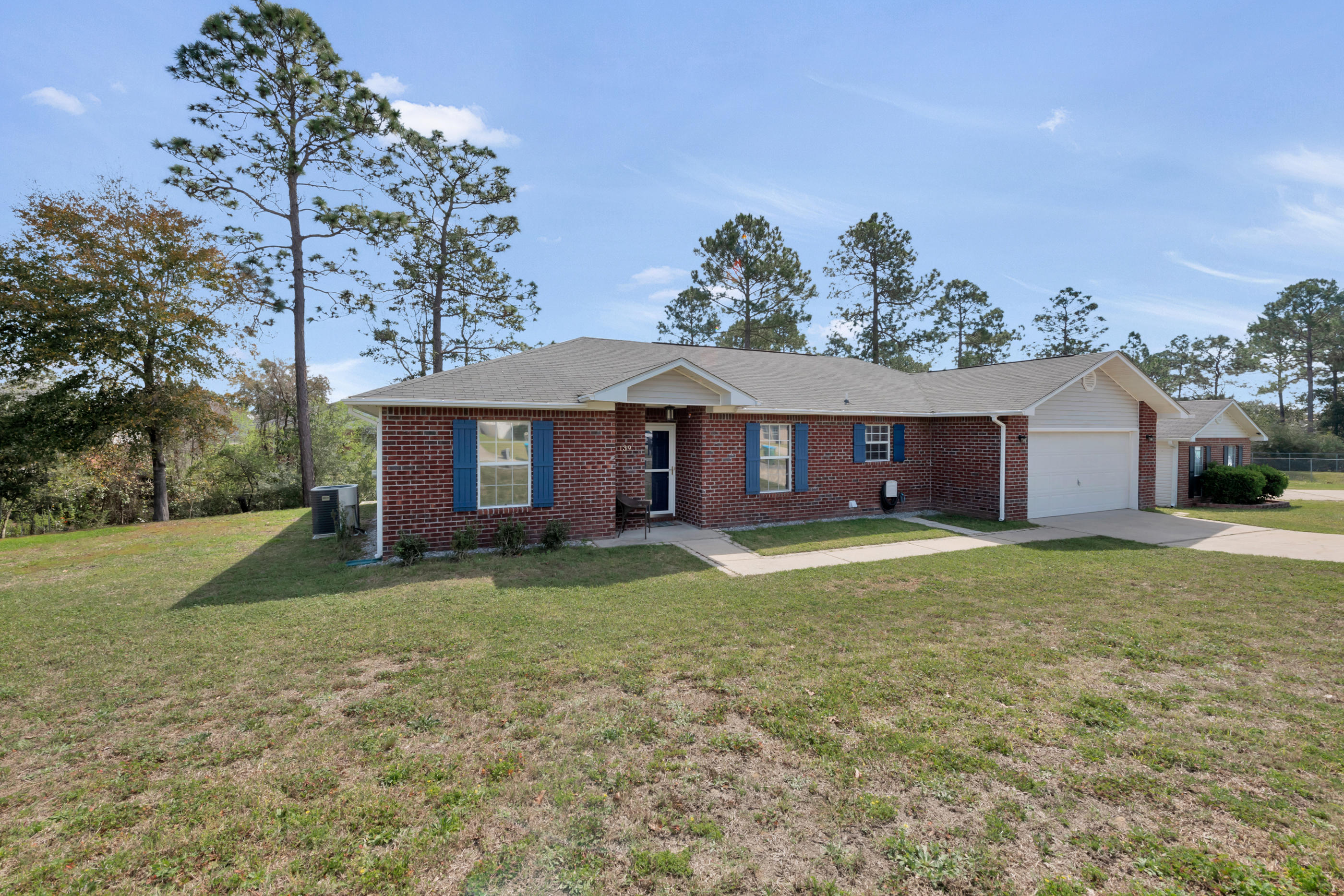 139 Sandstone Trail Crestview, FL 32539 - Photo 36 of 36 a view of a house with a yard