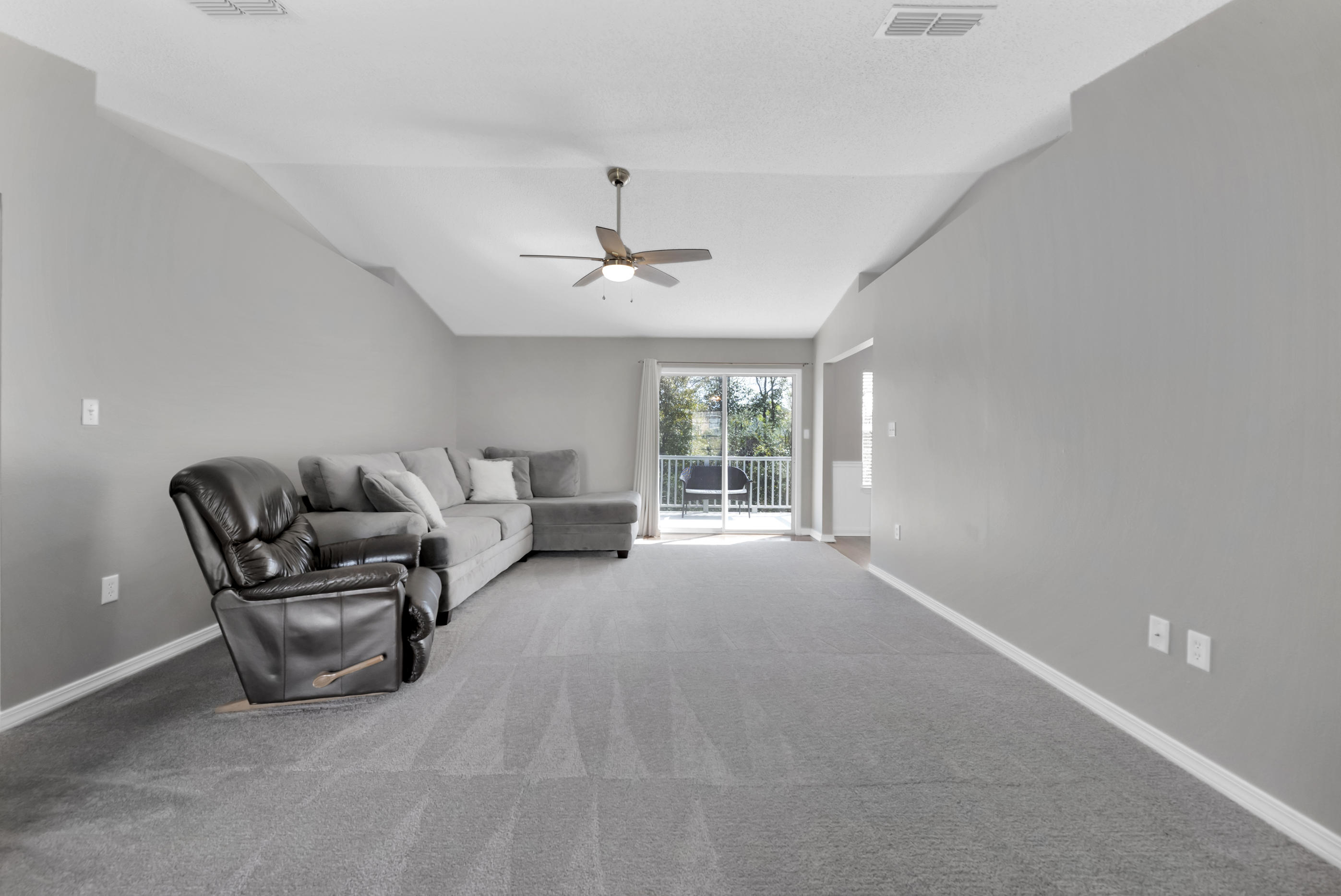 139 Sandstone Trail Crestview, FL 32539 - Photo 6 of 36 a living room with furniture and a large window
