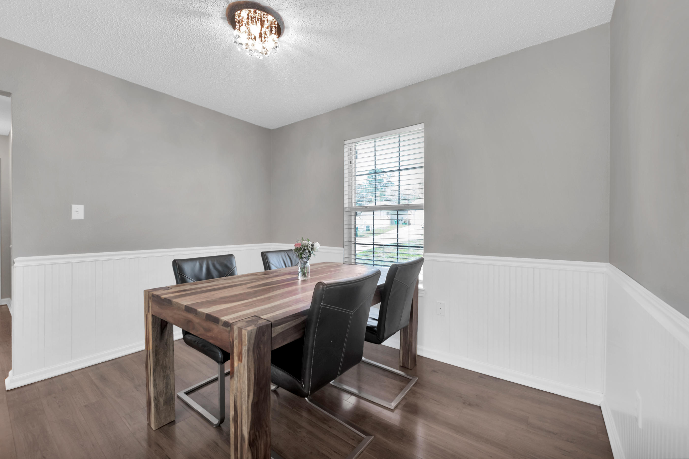 139 Sandstone Trail Crestview, FL 32539 - Photo 9 of 36 a view of a dining room with furniture and a chandelier