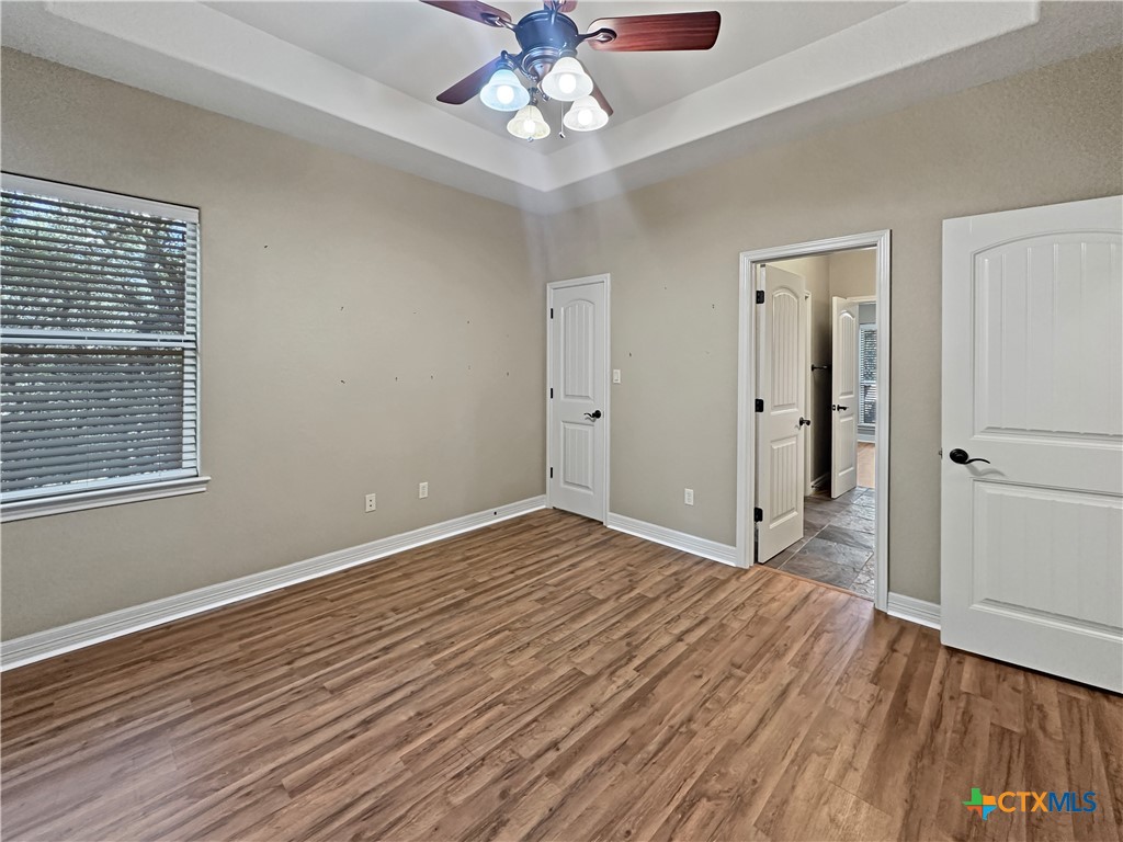 386 Wentworth Spring Branch, TX 78070 - Photo 14 of 39 wooden floor in an empty room with a window