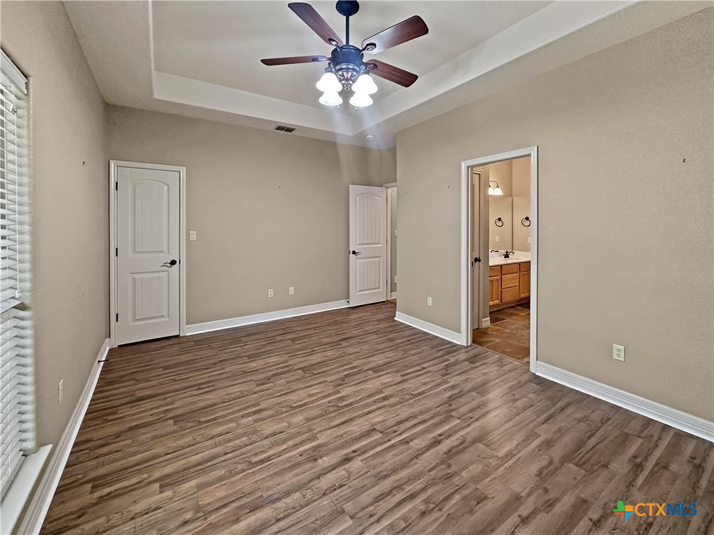 386 Wentworth Spring Branch, TX 78070 - Photo 16 of 39 wooden floor in an empty room with a window