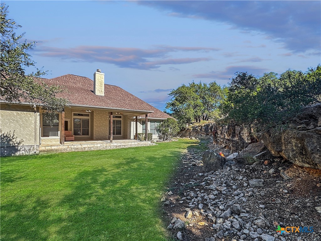386 Wentworth Spring Branch, TX 78070 - Photo 25 of 39 a front view of a house with garden