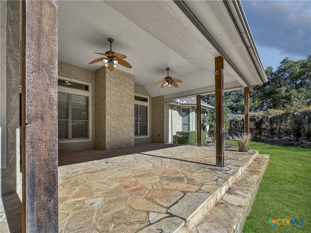 386 Wentworth Spring Branch, TX 78070 - Photo 27 of 39 a view of a porch with a floor to ceiling windows and yard