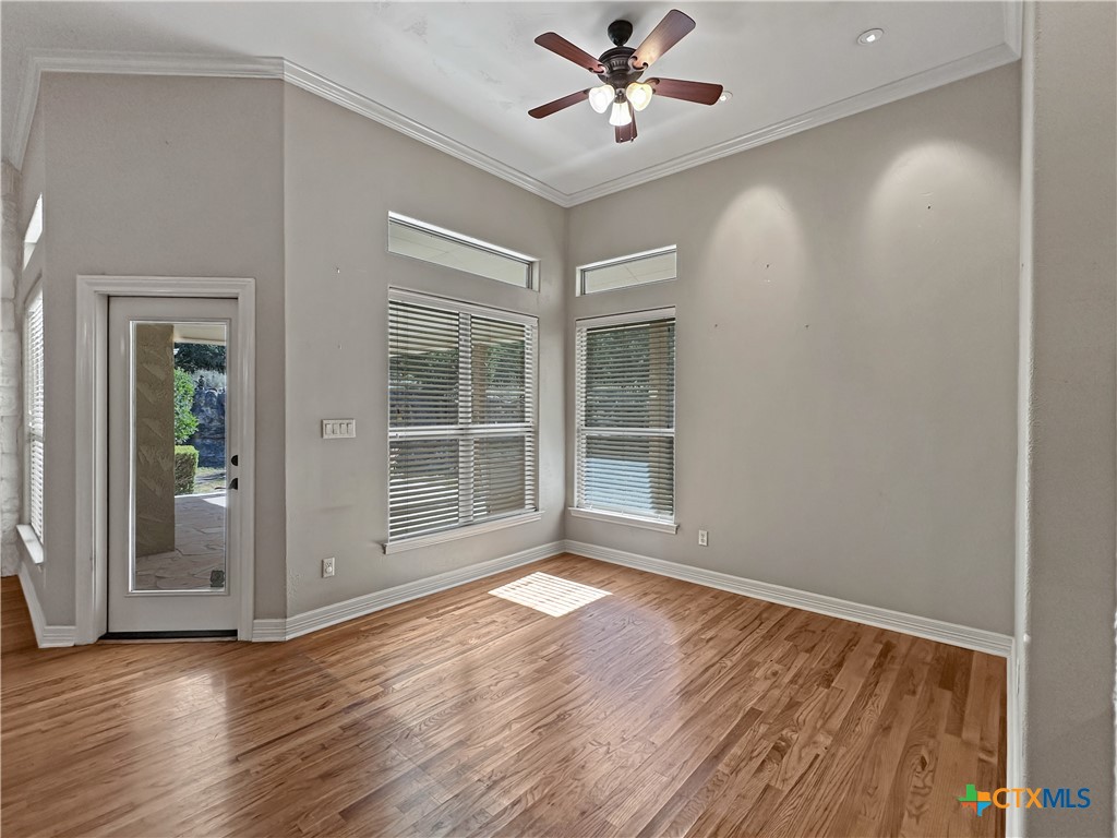 386 Wentworth Spring Branch, TX 78070 - Photo 10 of 39 a view of an empty room with wooden floor and a window
