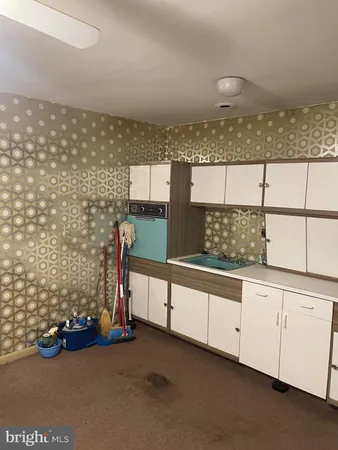 a utility room with cabinets