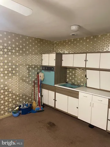 a utility room with cabinets
