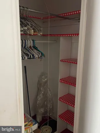 a lobby with furniture and a potted plant