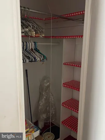 a lobby with furniture and a potted plant